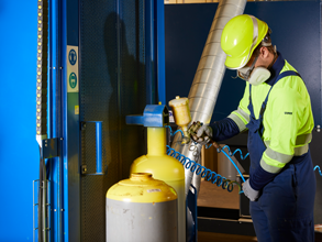 Employee paints chlorine gas cylinder